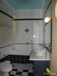 photo he bathroom of n the second from the apartments of "Vergos house" accommodation in Parga. 